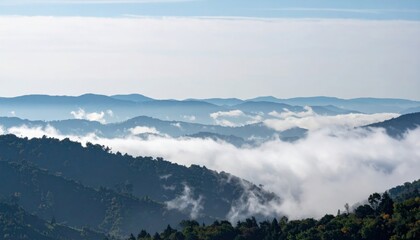 Fototapeta premium Exploring majestic mountain landscapes amidst misty clouds in nature's serenity scenic view photographic landscape