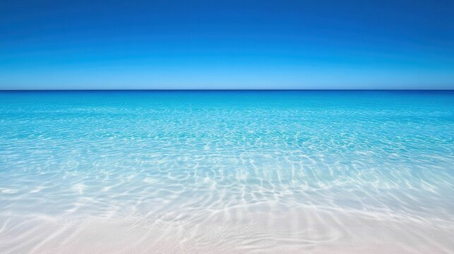 Clear turquoise water over white sand beach.