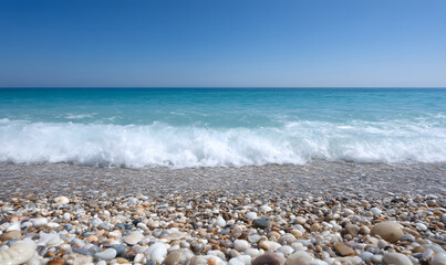 Waves Washing Pebbles on a Sunny Beach, Clear Blue Sky and Turquoise Water. generative ai