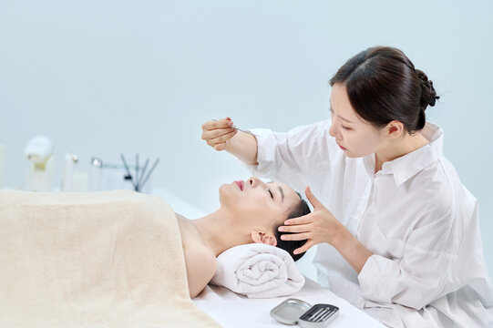 Female Facial Extraction Treatment by Professional Esthetician at Spa