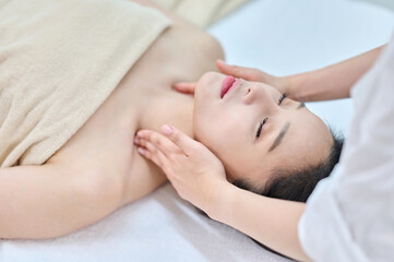 Female Neck and Shoulder Massage Therapy for Relaxation at Spa