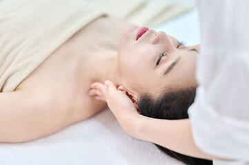 Female Neck and Shoulder Massage Therapy for Relaxation at Spa