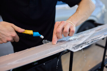 Applying a Protective Film on the Surface of Your Car for Enhanced Durability and Shine