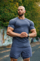 Muscular man in sportswear outdoor. Athletic male outside