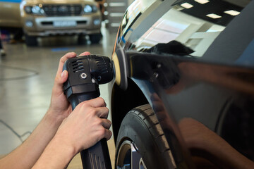 A Detailed Close Up of the Car Polishing Process in the Field of Automotive Detailing