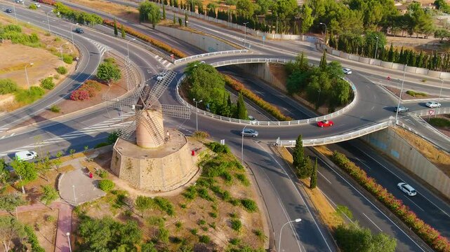 The old stone mill by the ring road. Sunset. Video from a drone. Santa Ponsa. Mallorca.