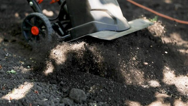 Land cultivation with an electric cultivator.