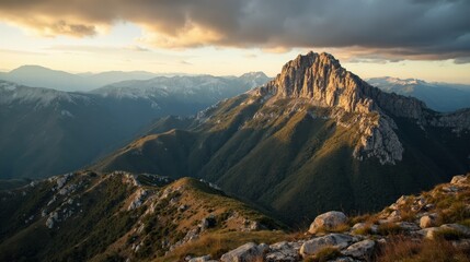 Mountain range (Sierra de Guadarrama) seen from above at dawn under cloudy skies.