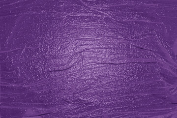 Purple paint texture creating a vibrant and textured background
