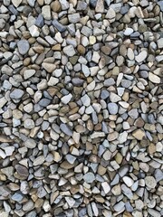 Pile of Mixed Grey and Brown Crushed Stone and River Rocks