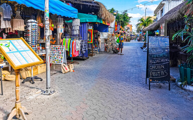 Typical colorful tourist streets sidewalks restaurants stores Isla Mujeres Mexico. © Arkadi