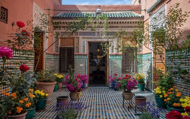 Summer Santorini, Greece, Moroccan riad courtyard filled with flowers