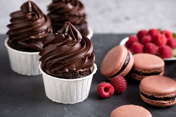 Chocolate cupcakes with thick and glossy ganache frosting