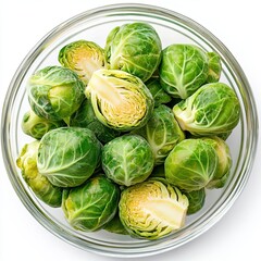 Obraz premium Fresh brussels sprouts in a clear bowl.
