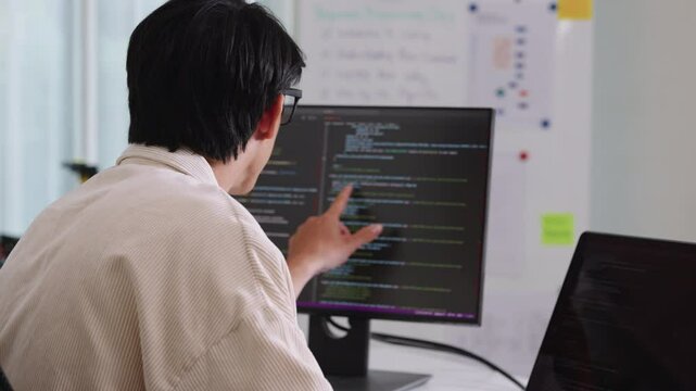 Developer software programmer computer coding screen working technology engineering monitor at modern workspace