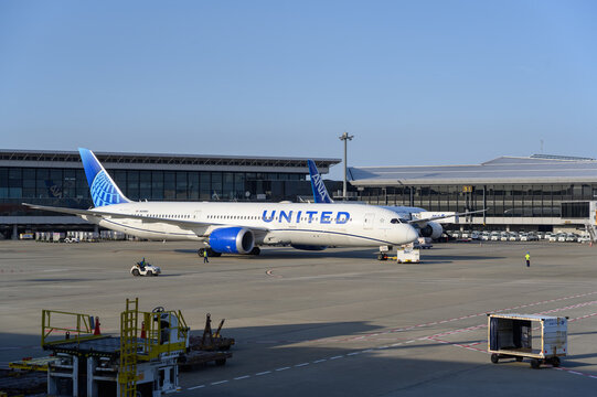 Narita, Japan &ndash; April 9, 2025: United Airlines aircraft being serviced, parked at passenger gate at Narita International Airport (NRT), Tokyo.