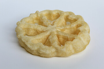 Kembang goyang cake, traditional snack from Indonesia. Fried dough in wheel or flower shaped. Isolated on white backgroun