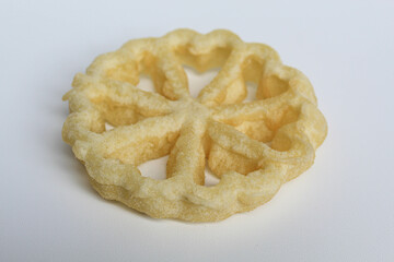 Kembang goyang cake, traditional snack from Indonesia. Fried dough in wheel or flower shaped. Isolated on white backgroun