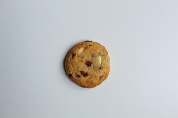White choco soft cookie with almond and berry cuts, isolated on white background, flat lay or top view