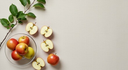 Red And Green Apples In Glass Bowl On Beige Textured Background