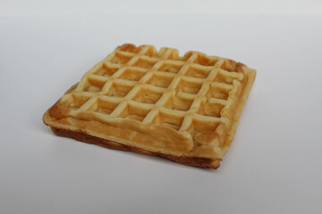 One plain waffle cake, isolated on white background