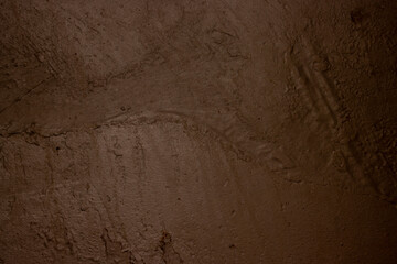 Brown colored abstract wall background texture with different shades of brown