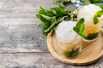 Classic Mint Julep Cocktail on wooden table. Copy space	