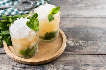 Classic Mint Julep Cocktail on wooden table. Copy space	