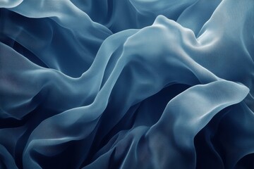 Obraz premium A close-up view of flowing, draped sheer fabric in a soft blue tone. The folds and texture are prominent, showcasing its fluidity