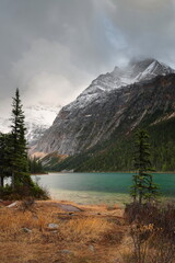 Rainy autumn evening over emerald-green Cavell Lake, snowy peaks (R-L) Sorrow (3010 m) and Edith Cavell (3363 m) in back. Jasper NP-Alberta-Canada-209