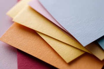 Colorful paper sheets stacked in flat lay arrangement