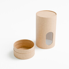 eco-freindly cylindrical paper packaging with clear window, kraft paper tube mockup, brown craft gift box with window display, luxury corrugated paperboard packaging, tall tin can paper food packaging