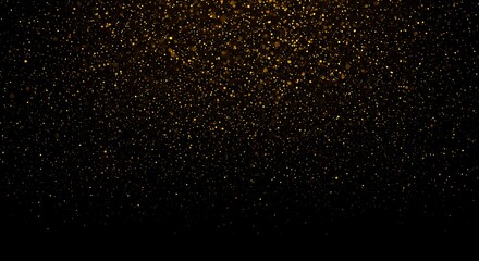 Golden glitter sparkles falling on black background for festive backdrop