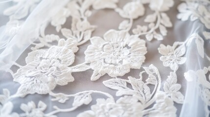 Fototapeta premium Elegant Floral Lace Embroidery on Soft Fabric with Delicate White Design for Fashion and Crafts