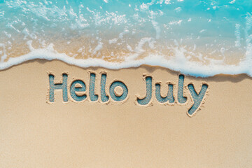 Hello july written on the beach sand with incoming wave