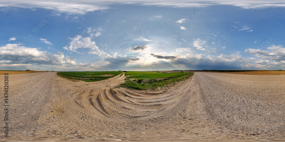 Wall mural hdri 360 panorama view on gravel muddy road among fields at evening with flock of birds in clouds in