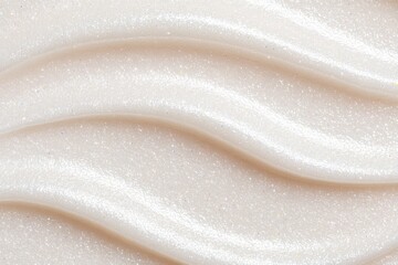 On a neutral background, there is an abstract swirled gel texture