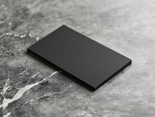 Blank black business card on marble surface (1)