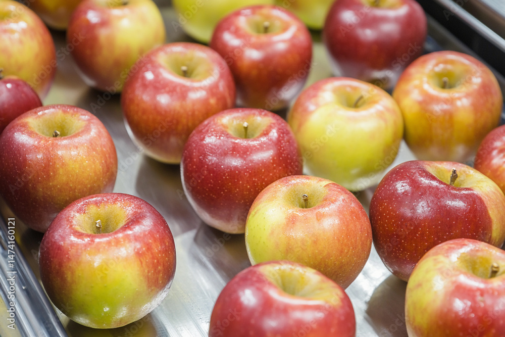 Poster ripe apples moving on conveyor belt in processing facility generative ai