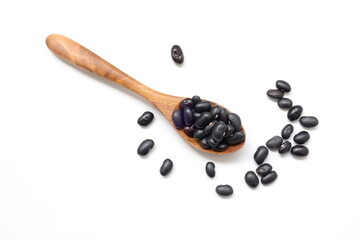 Black beans in wooden spoon