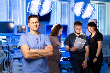 Healthcare team works together. Medical professionals work together in a brightly lit room, reviewing documents and discussing patient care strategies.