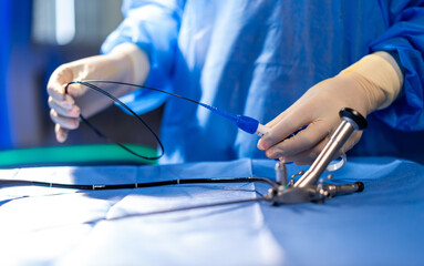 Medical surgical tools. A healthcare worker prepares sterile surgical instruments in the operating...