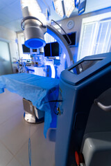 OR set for medical procedures. A modern surgical room features advanced equipment and clean surfaces ready for medical procedures and operations.