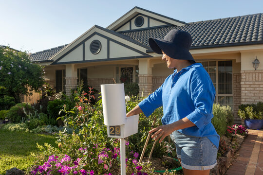 Woman Engaged in Daily Routine at Home in Australia