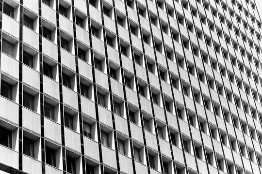Geometric facade with repetitive pattern in black and white in Sidney