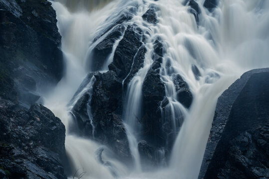 Detailed long exposure shot of cascading water over rocks