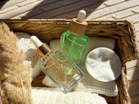 Natural skincare cosmetics in a wicker basket setting on th bathroom