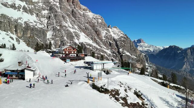 Cortina d'Ampezzo, Italy: Aerial view of famous ski resort in Dolomites (Dolomitic Alps)  and venue of Winter Olympics Milano Cortina 2026, sunny day - landscape panorama of Europe from above
