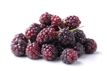 A pile of ripe blackberries, glistening with a dark, purplish hue, sits against a stark white background.