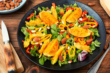 Salad of cactus fruits, peppers and almonds.